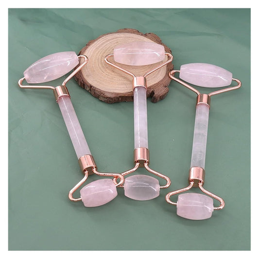Natural Jade Roller for Face & Neck displayed on a wooden surface with a green background.